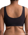 model wearing d+ cup proclaim everyday bralette scoop style in black