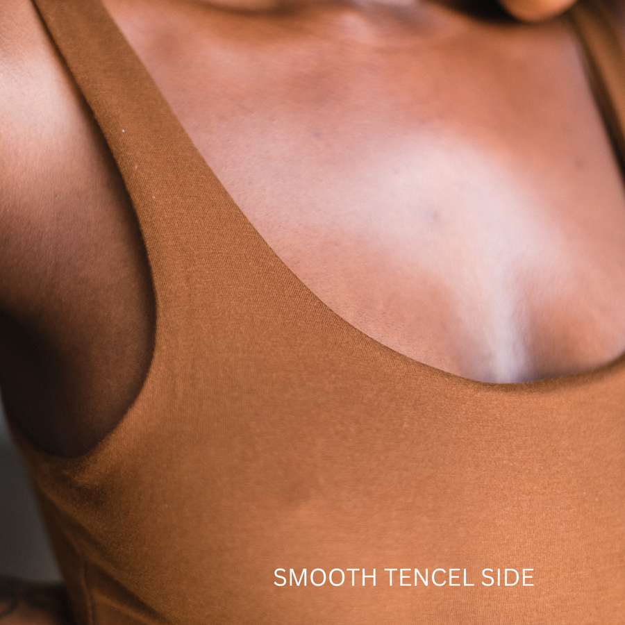 Close up of flat smooth tencel side of the reversible bodysuit