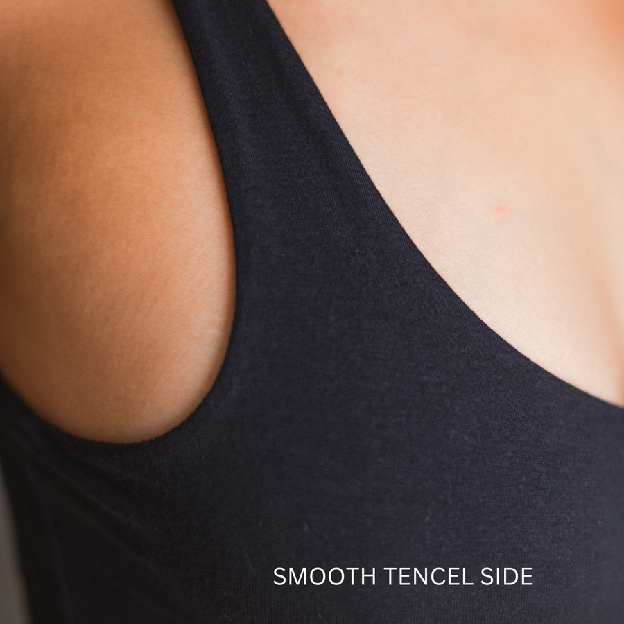 Close up of the flat tencel side of the reversible bodysuit