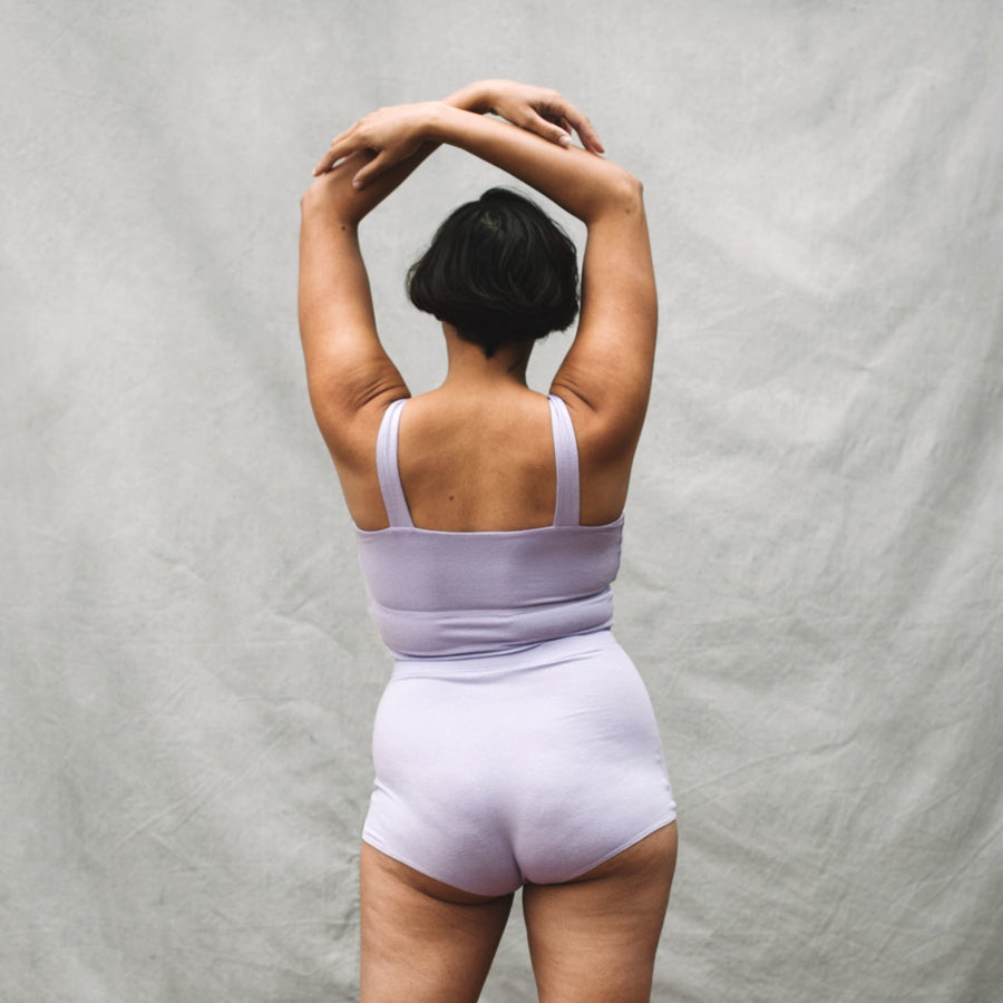 Proclaim Color Pop Collection Organic Cotton and Hemp Bralette in Lilac on Model wearing XL D-DDD Cup Bralette and XL High Rise Brief, back view