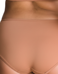 Back view of PROCLAIM Maya medium nude organic cotton mid-rise brief underwear, close up