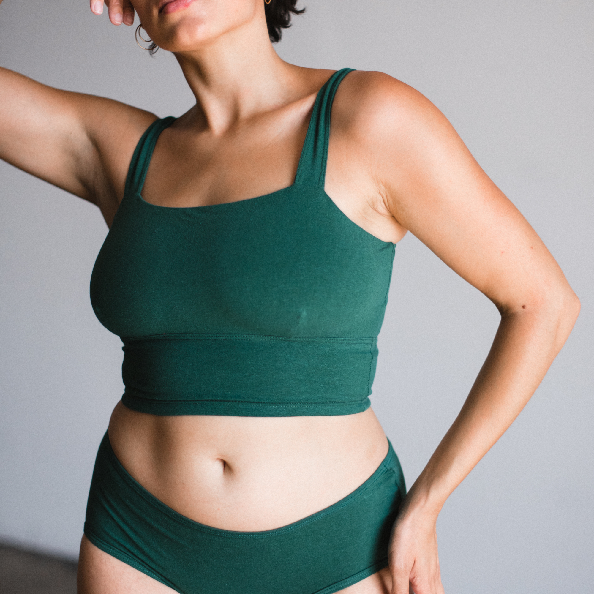 Organic cotton square neck bralette in lagoon dark green on model