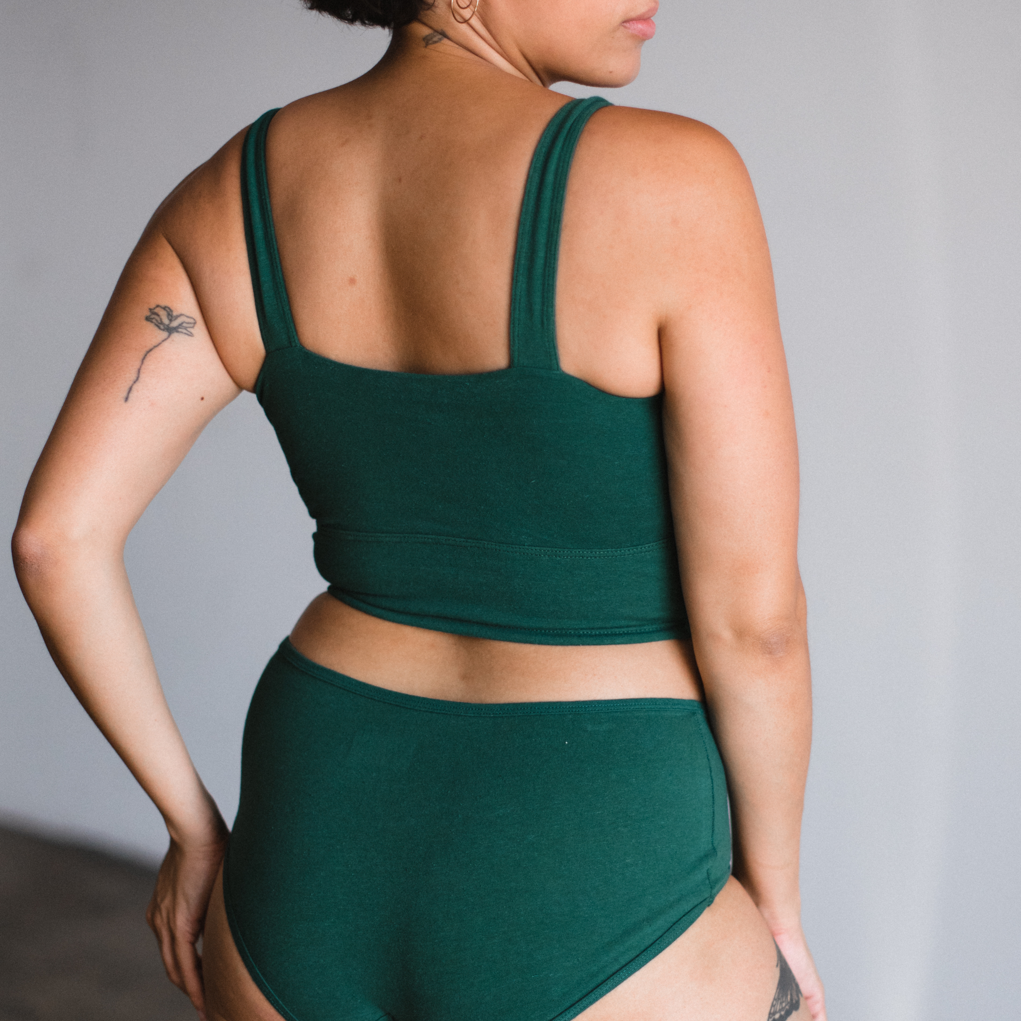 Proclaim Organic cotton square neck bralette in lagoon dark green shown on model back view
