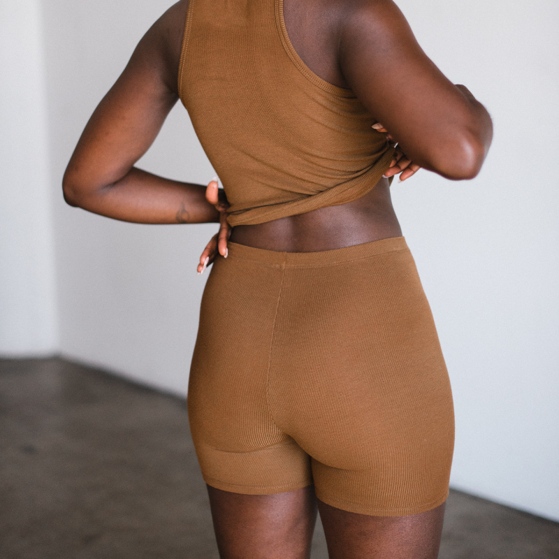 ella chocolate brown biker brief short made from sustainable tencel. back view on model