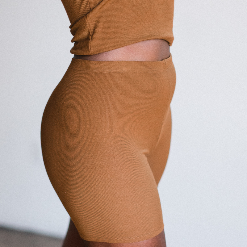 ella chocolate brown biker brief short made from sustainable tencel. side view on model