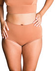 woman wearing proclaim high rise brief underwear in maya medium nude, front view