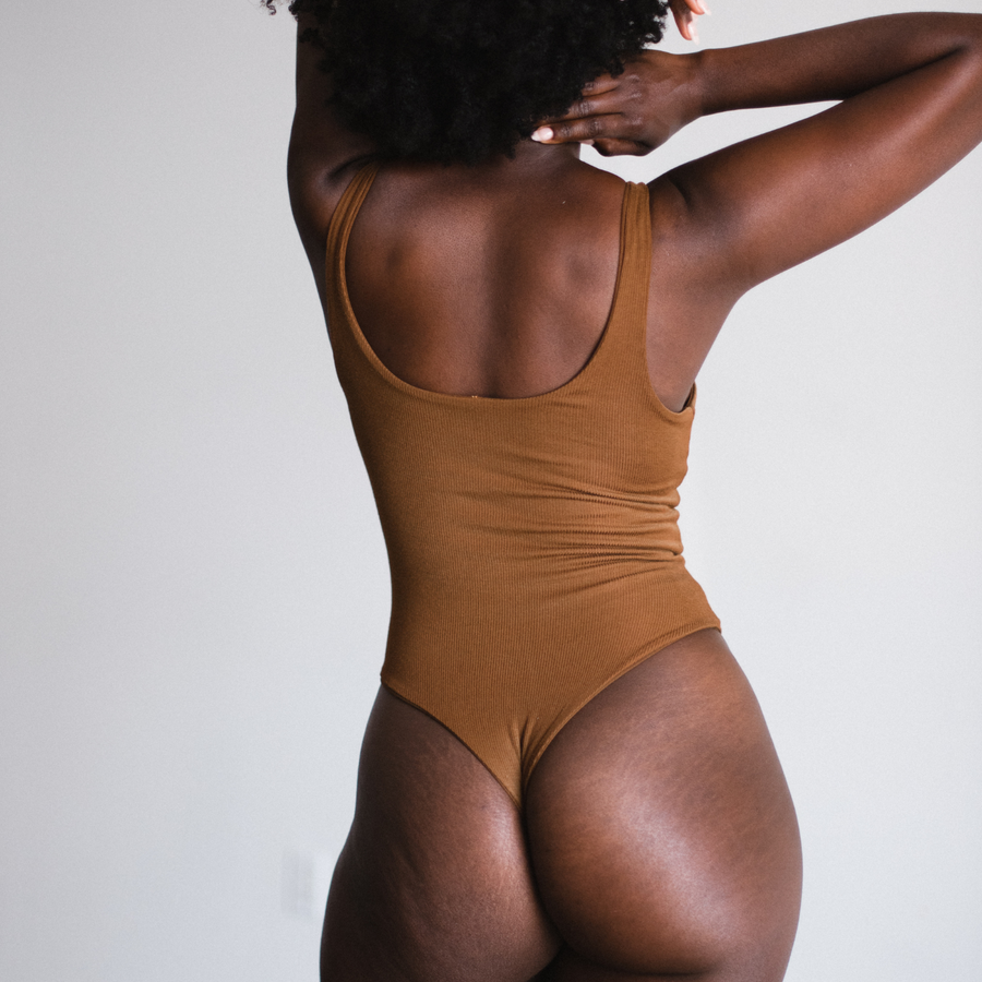 model showing back view of bodysuit